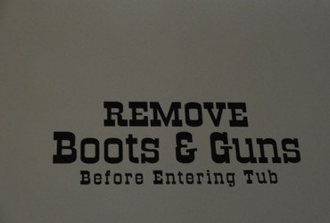 Remove Boots & Guns Before Entering Tub