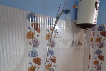 Shower heads are rare and they are usually not mounted on the wall, so I fixed it with bamboo sticks - Munsiyari, India