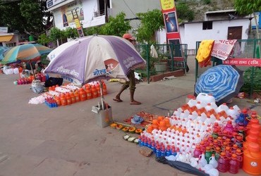 Good business selling bottles for the water from the sacred river - Rishikesh, India